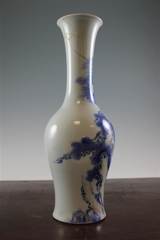 A Chinese underglaze blue and copper red crane and deer bottle vase, Kangxi six character mark, early 20th century, 39.5cm., neck rep